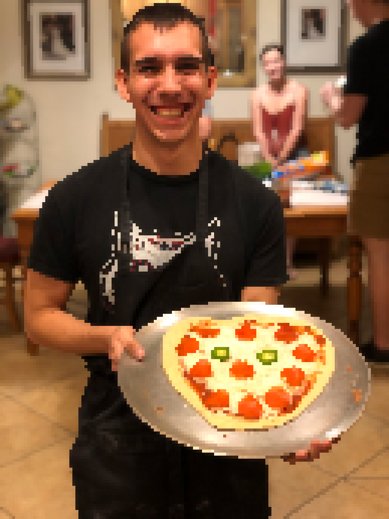 Jose with a pizza
